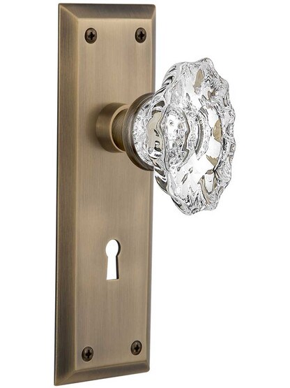 New York Style Mortise-Lock Set with Chateau Crystal Glass Knobs in Antique Brass.